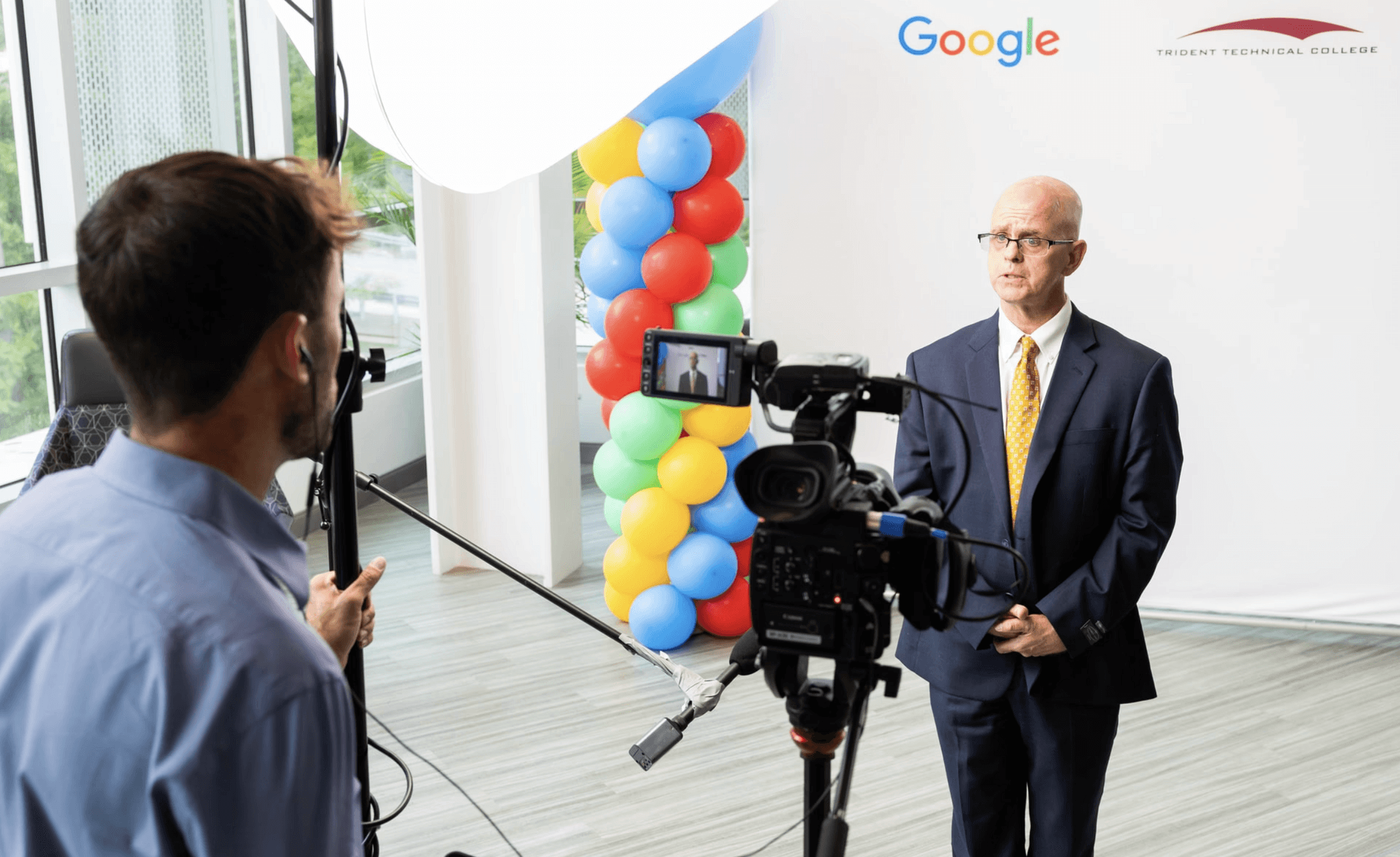 Creative Olsen filming corporate event video at conference in Omaha